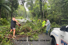 Police and residents clear the road at Cow Bay. Picture: QPS