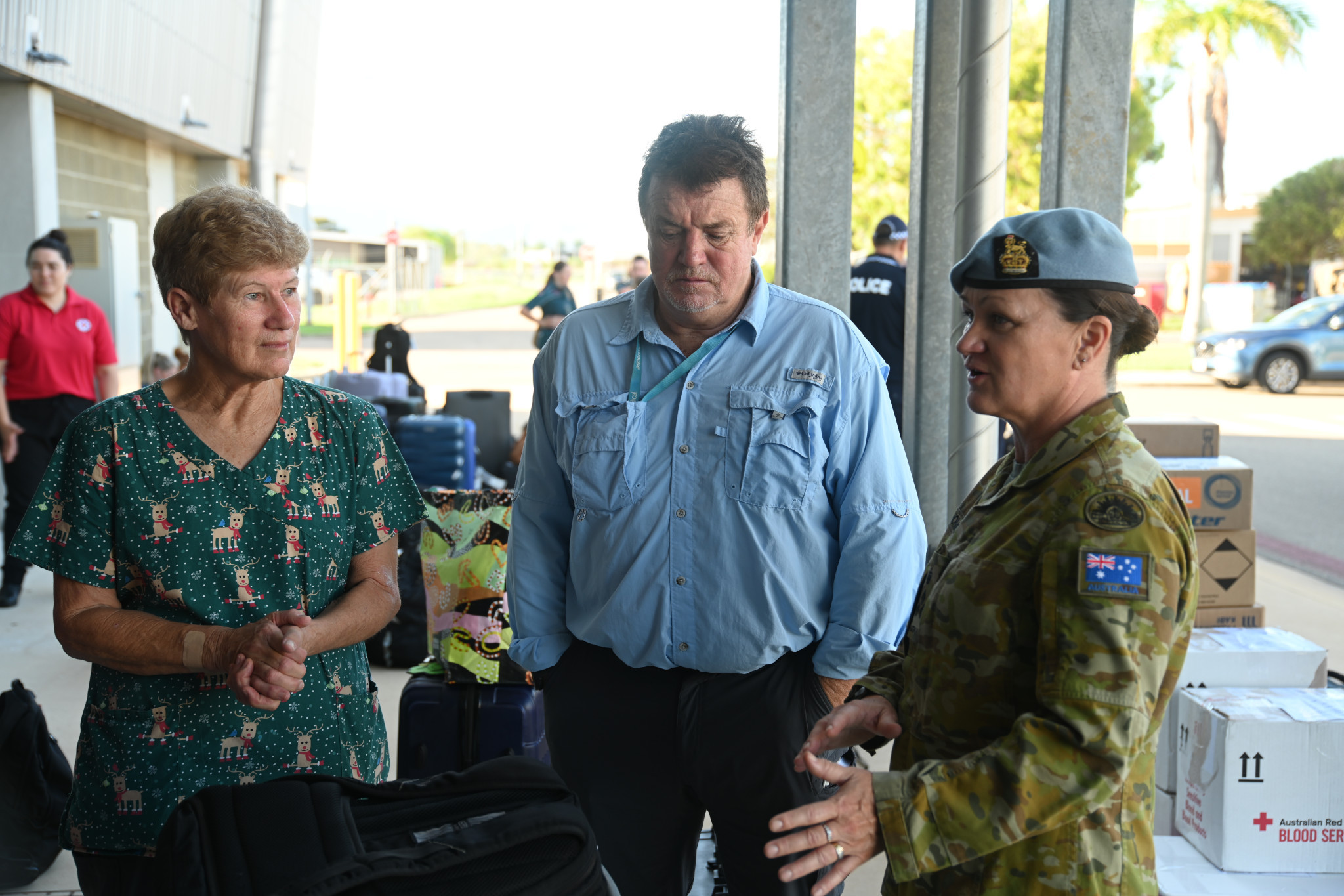 Commander of 16th Aviation Brigade, Brigadier Fern Thompson CSC, speaks with personnel from emergency services supporting residents of the Far North Queensland region following the impacts of Ex-Tropical Cyclone Jasper at RAAF Base Townsville, Queensland.