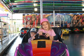 Romy and Ario Saint from Redlynch enjoying the bumper cars at the Cairns Show.