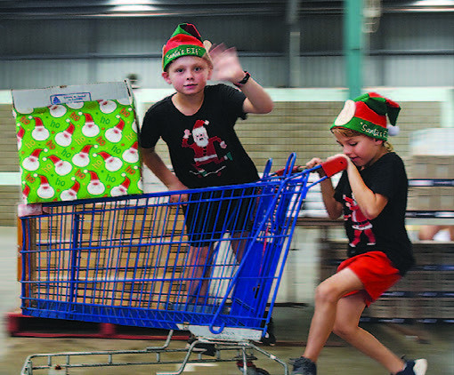 (l-r) Blake and Kyle Chaplin helping with the food hamper packing