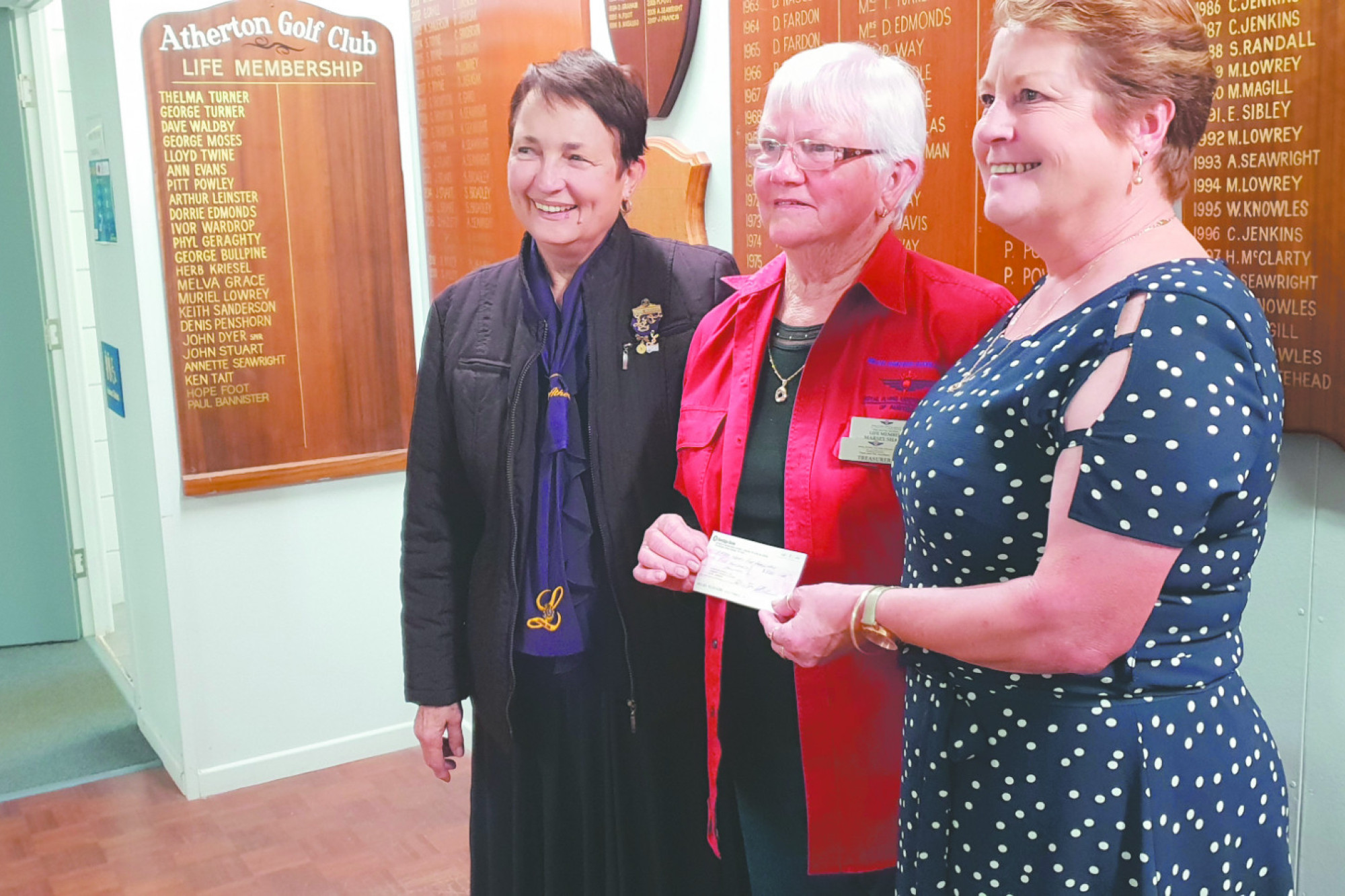 RFDS Near and Far Volunteer Auxiliary Treasurer Marsey Shand, centre, receiving the donation from Atherton Lioness President Tracey Curtis, right, and Treasurer Denise McGucken, left, who is also a joint Treasurer of the RFDS Near and Far Volunteer Auxiliary.