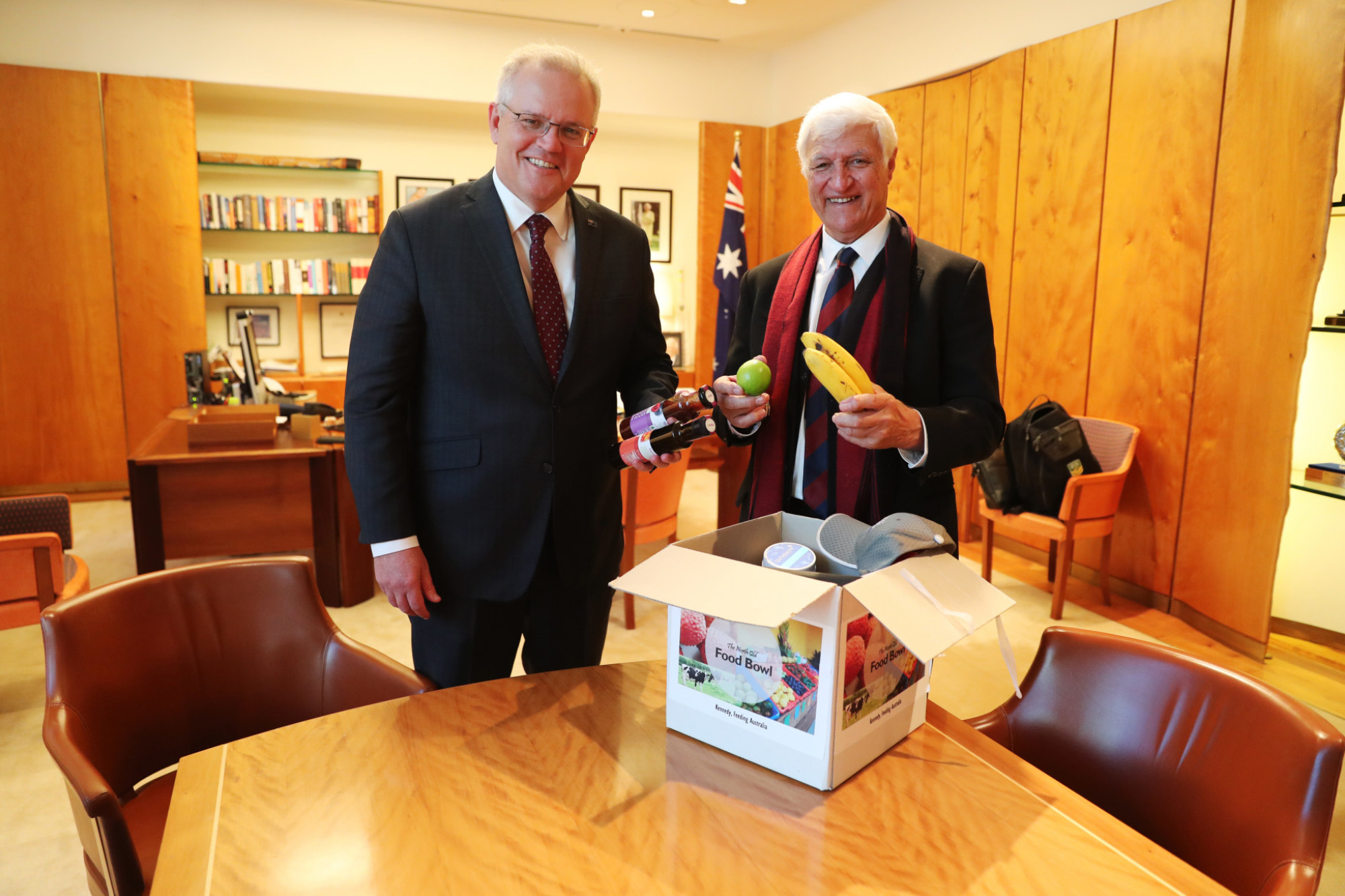 Member for Kennedy Bob Katter with Prime Minister Scott Morrison opening up a food bowl.