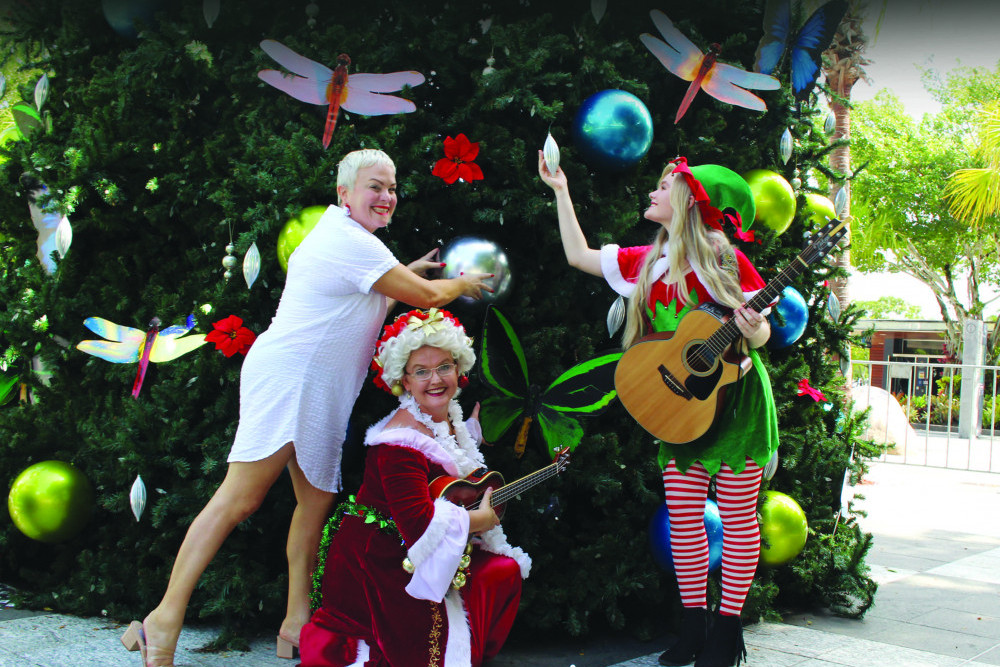 Cr Kristy Vallely, Mrs Claus and her Elf. PHOTO: Isabella Guzman