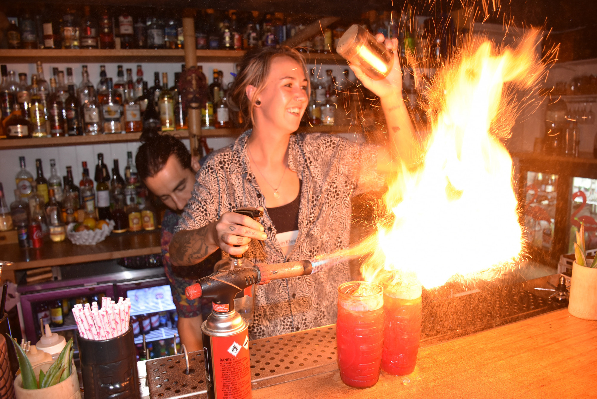 Megs Douglas firing up the signature Zombie cocktail at Flamingos Tiki Bar