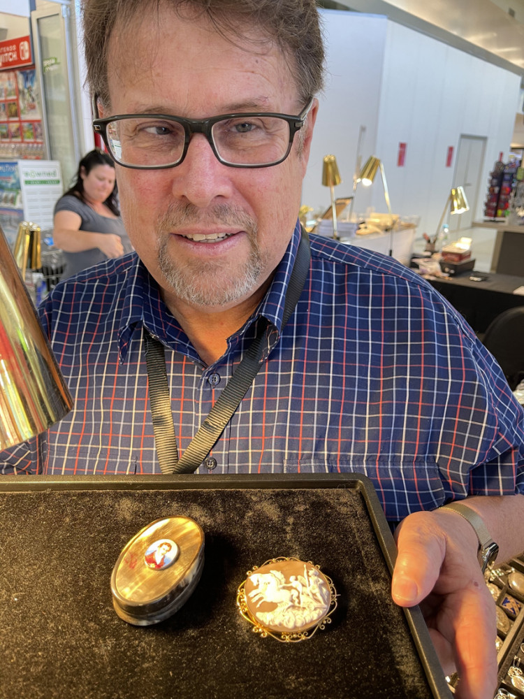 Cairns Antique Fair stallholder Richard MacDonald with a horn snuff box, and an 18ct cameo depicting Celtic rebel Queen Boedica, both from the late 1700s