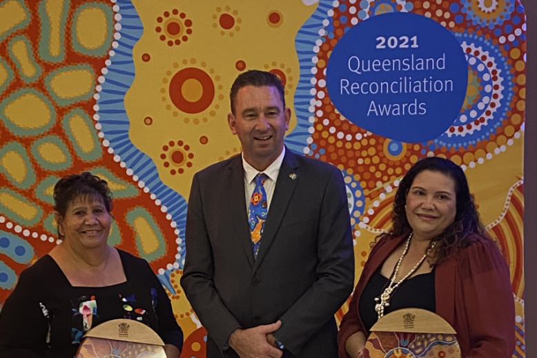 Daintree traditional owners Lyn and Michelle Johnson from the Jabalbina Yalanji Aboriginal Corporation with the awards presented by Minister for Aboriginal and Torres Strait Islander Partnerships Craig Crawford.