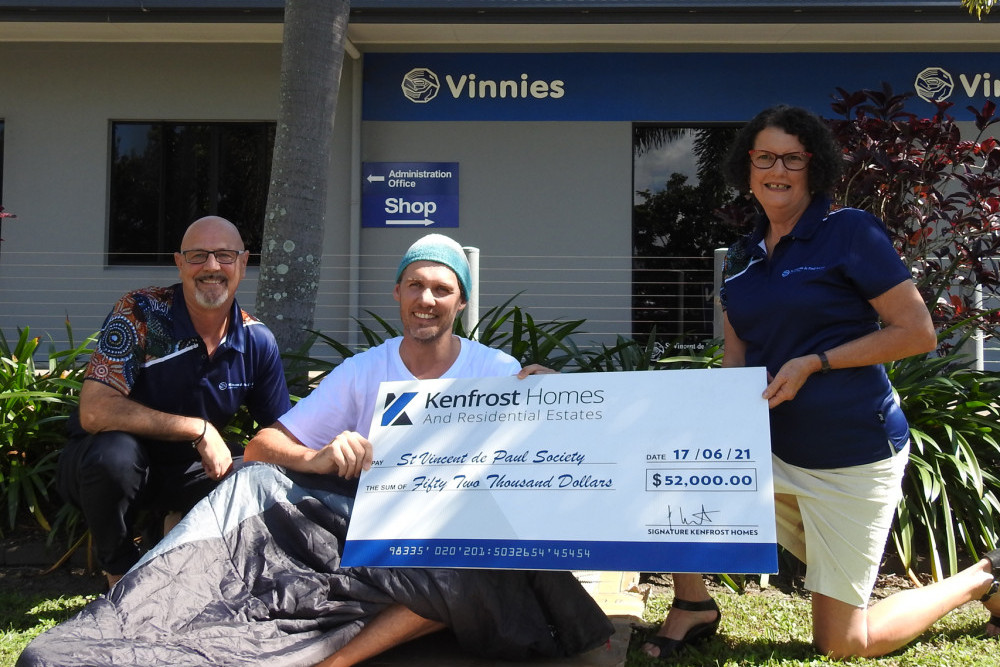 David Monaghan, Executive Officer for Vinnies with Veronica Innes, FNQ President of Vinnies accepting the generous donation of $52,000 from Alex Loughton on behalf of Kenfrost Homes. PHOTO: Peter McCullagh