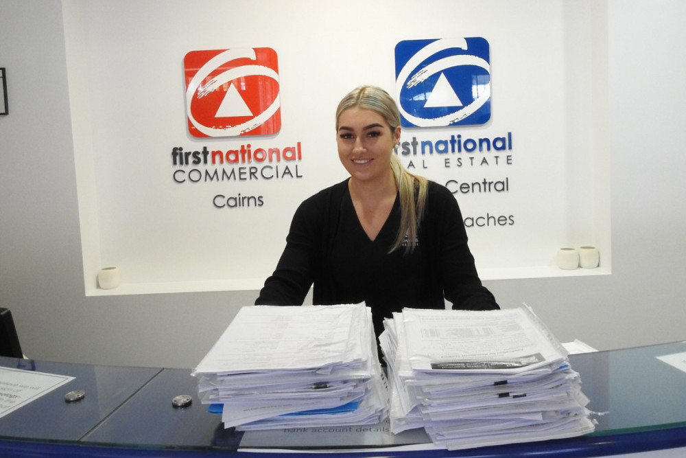 Aleisha Heyne, First National Real Estate Cairns Central's Rental Application Processor with some of last month's applications