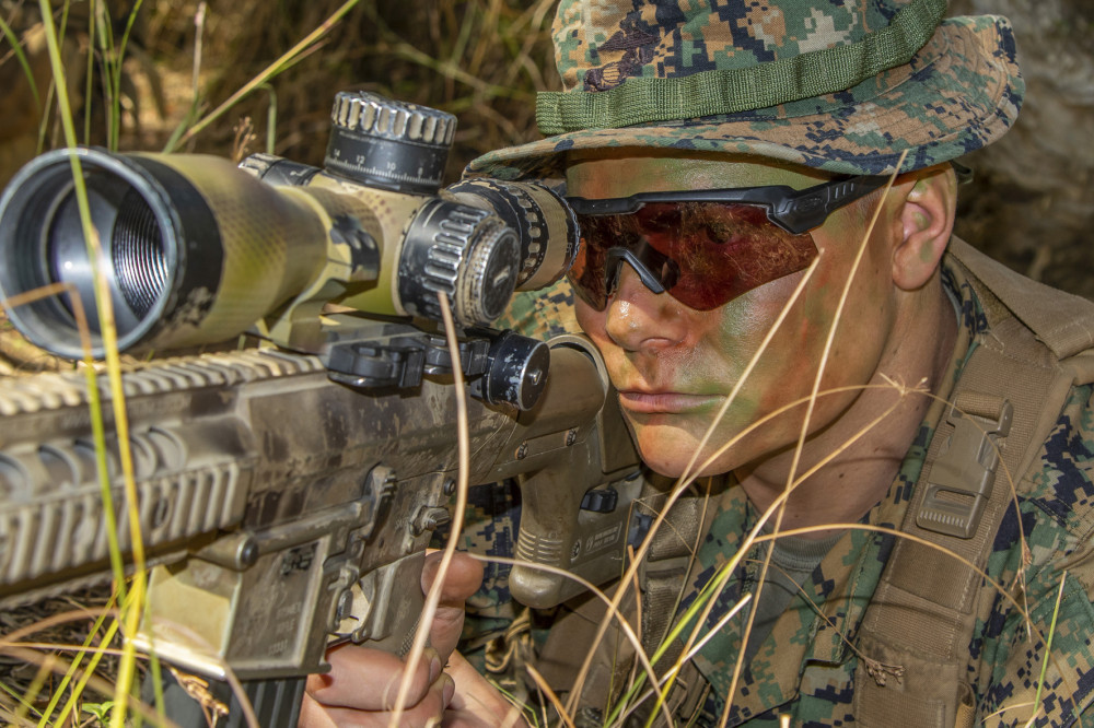 U.S. Marine Cpl. Nicholas Umbarger, who serves with Surveillance and Target Acquisition, 2nd Battalion, 1st Marine Division, scans his sector near Stanage Bay, Queensland, Australia, July 16, during Exercise Talisman Sabre 2019. (U.S. Army photo by Sgt. 1st Class Whitney C. Houston)