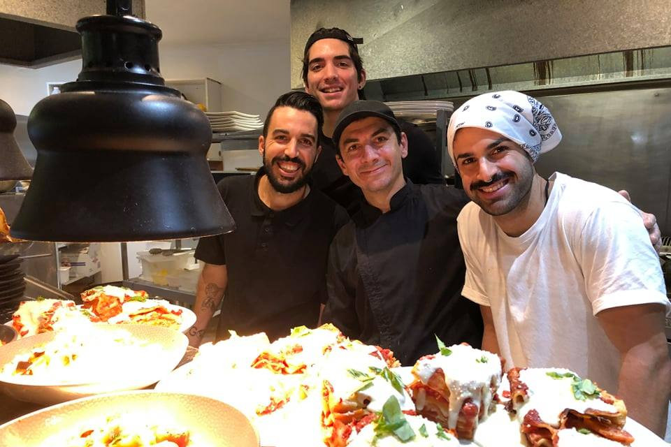 Il Chiosco restaurant owners Silvano Giorgetti (left) and Matteo Guzzo (centre), with staff Dylan and Mauro with the ‘Local Food Feast’ they prepared