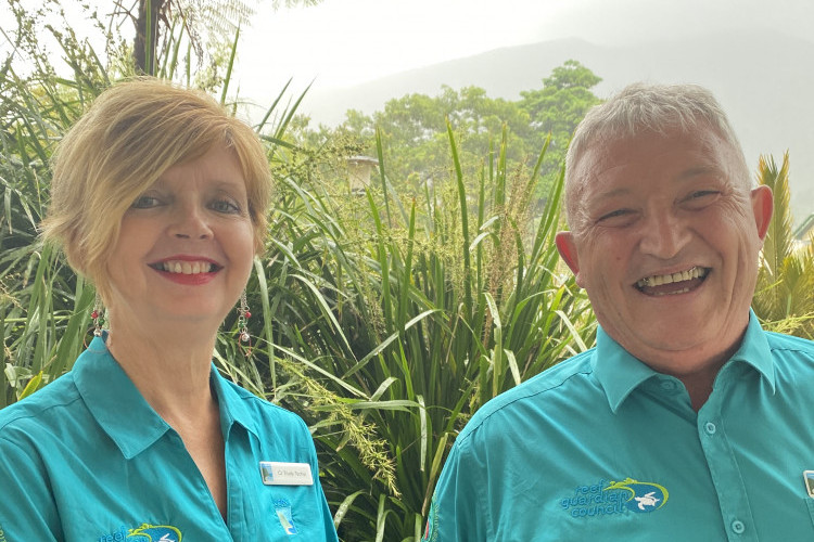 Cr Jeff Baines and Cr Trudy Tschui proudly wearing their Reef Guardian Council logos.