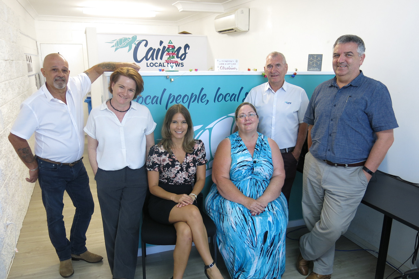 CAIRNS LOCAL NEWS TEAM: Business marketing manager Steve Andrews, administration officer Lisa Harris, journalist Tanya Murphy, business marketing manager Kath MacLean, business marketing manager Denis Olsson, and editor Peter McCullagh at the Cairns Local News office. (Absent) freelance journalist Nicole Gibson, graphic designer Michele Jules.