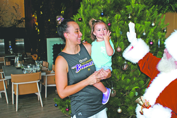 Ashleigh Karaitiana from the Melbourne Boomers with her beautiful daughter Kalea meets Santa at