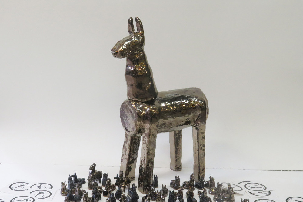 Traditional ceramic Llama sculpture, miniatures, and stickers. Facebook and Instagram posts followed the Llamas out into the real world.