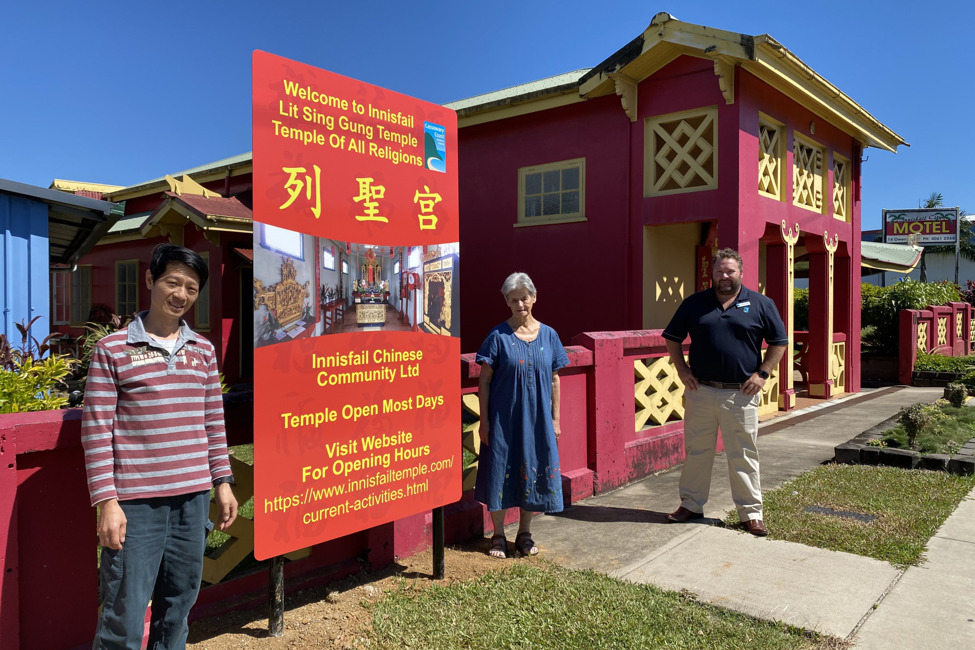 Innisfail Chinese Community Ltd President Allen Judson with Honorary Secretary Jean Rome and Cr. Nick Pervan stand by one of the new signs at the front of the Temple.