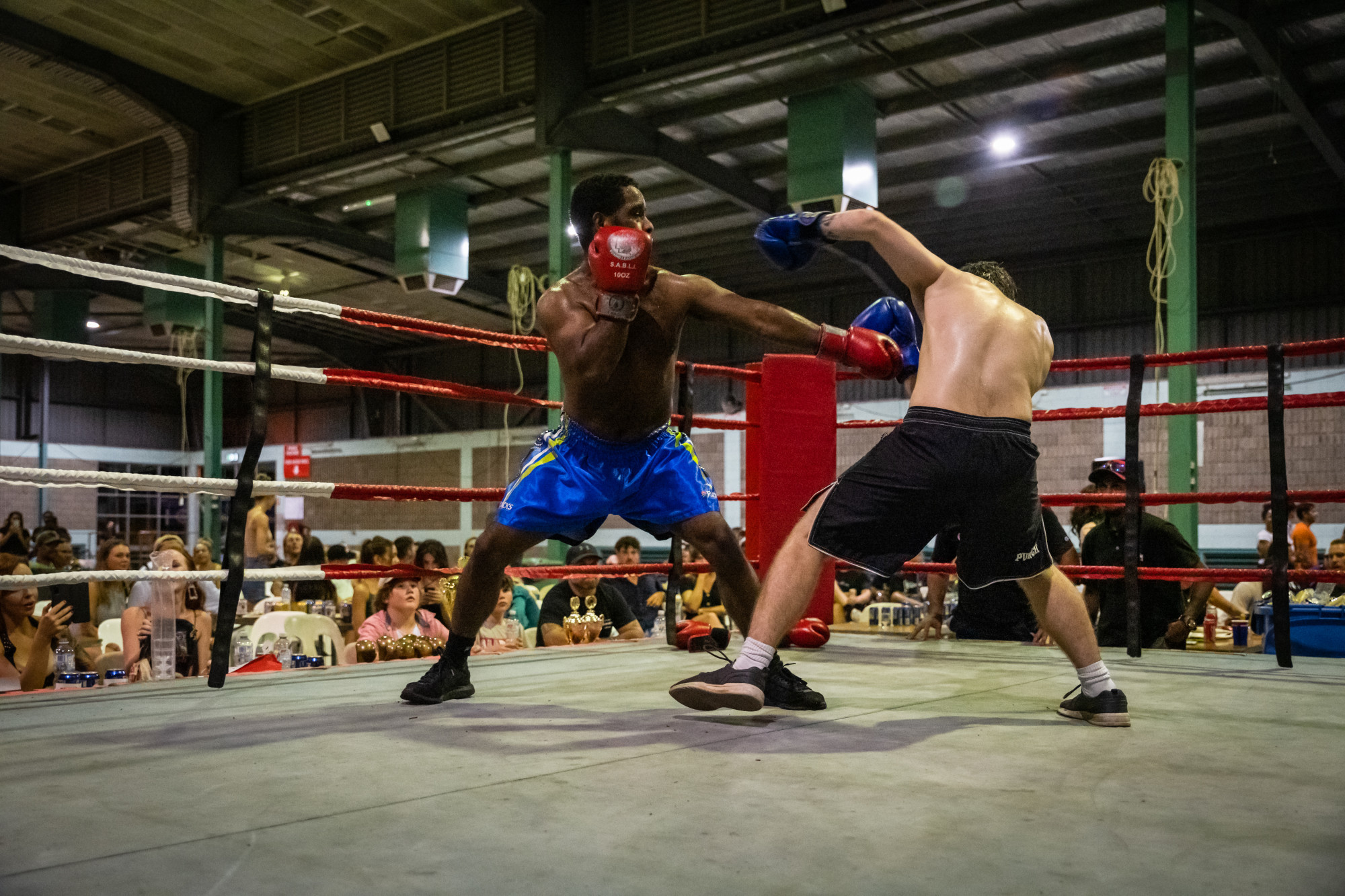 Edmonton local Curtis Kris (red gloves) defeated Daniel Tilley at the Cairns Charity Fight Night on Saturday. Photo: FNQRoar Photography