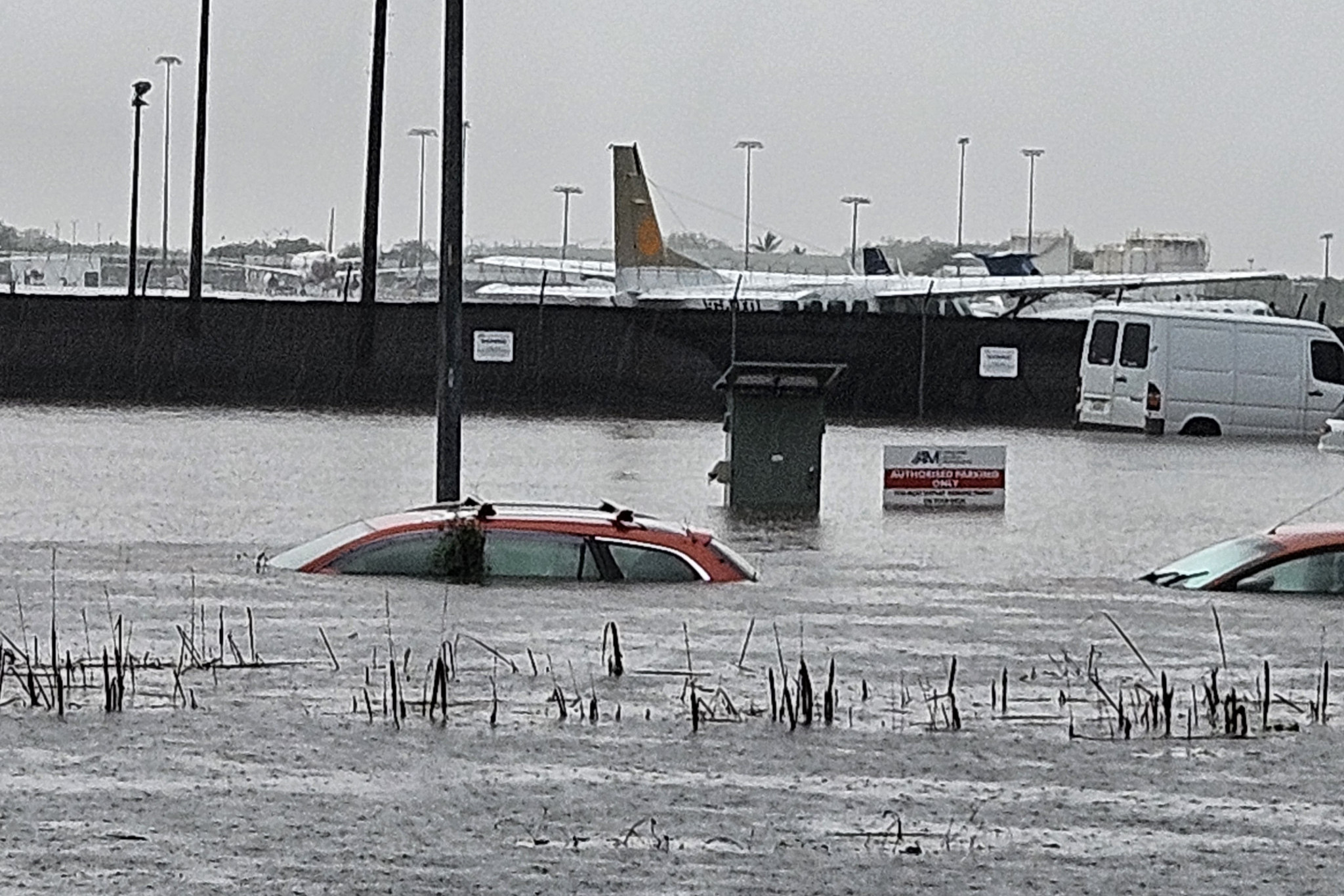 Picture shows submerged vehicles at Cairns Airport general aviation precinct. Picture: Nick Dalton