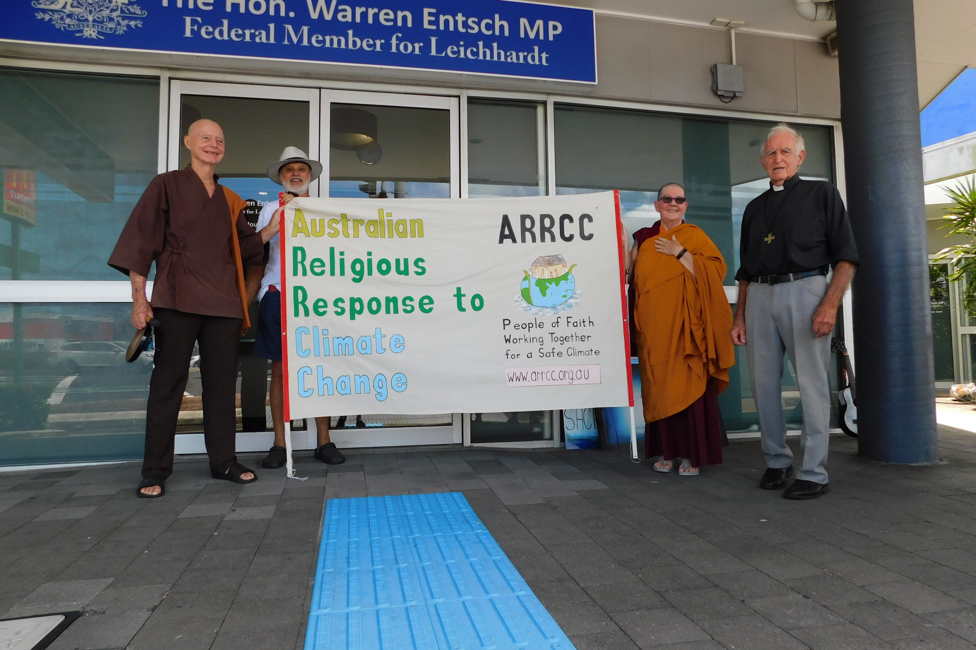 Cairns people of faith including the Khacho Yulo Ling Buddhist Center’s Venerable Rinchen, and Anglican Priest Neil Forgie (right) at Warren Entsch’s office last Thursday.