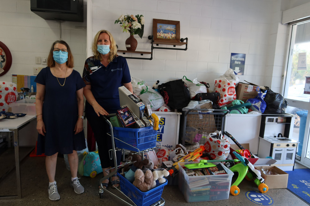 (l-r) Volunteer Angela Migala and Store Manager Kristy Cook, said that by the end of the week the donations would cover the whole wall - Photo: Isabella Guzman