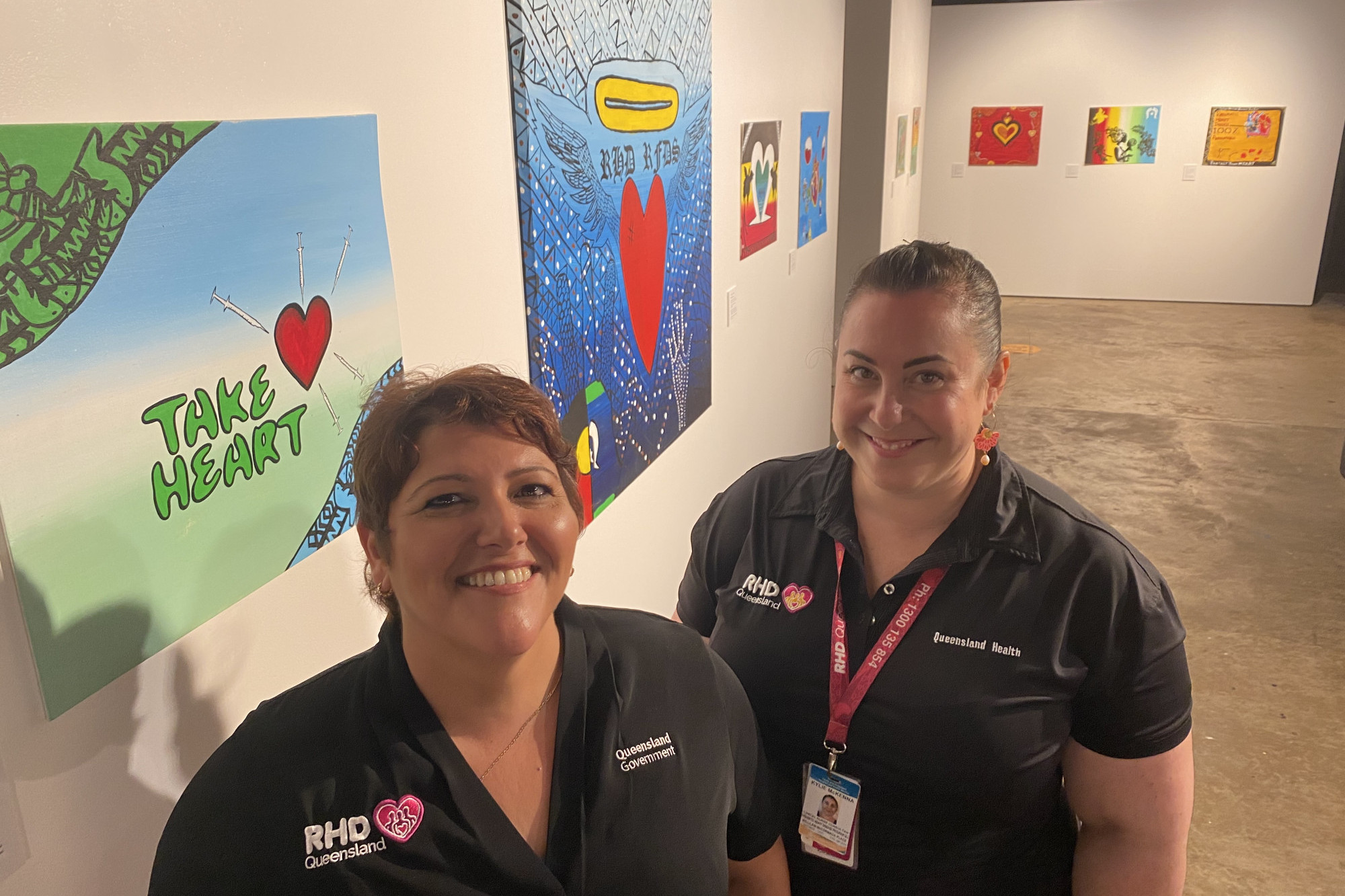 Townsville Clinical Nurse Consultant Georgina Hughes and RHD Program manager Kylie McKenna check out the artwork for the RHD (Rheumatic Heart Disease) themed exhibition at Tanks Art Centre, Edge Hill.
