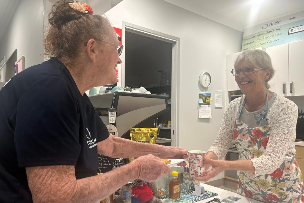 COUCH client Marg Moller receives morning tea and a chat from long-time café convenor and friend Traci Montague. Picture: COUCH