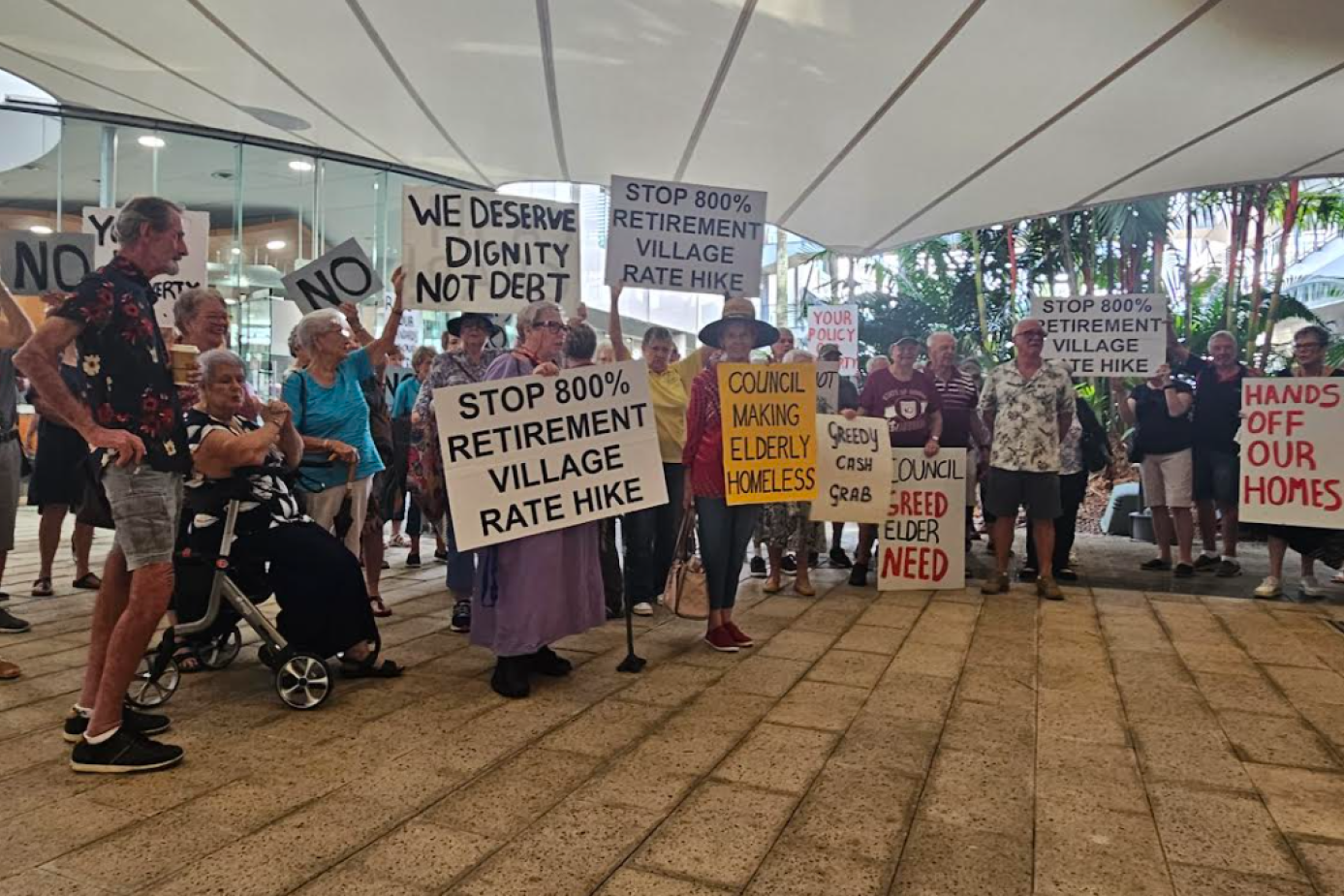 Pensioners, who have been protesting at the Cairns Regional Council chambers, are demanding an apology from Mayor Amy Eden. PIcture: Nick Dalton
