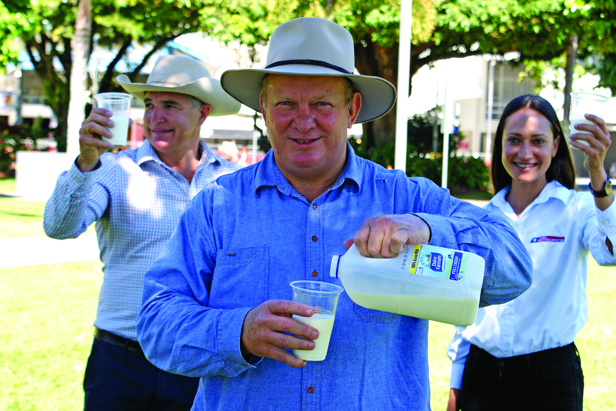 Member for Hill Shane Knuth, KAP Queensland Leader, Robbie Katter and KAP Candidate for Cook, Tanika Parker all toasting the Dairy Farmers with a glass of milk