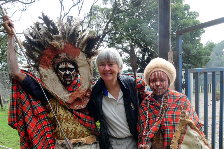 Cairns novelist and world traveller Jeanette McInnes with two Maasai in Kenya.