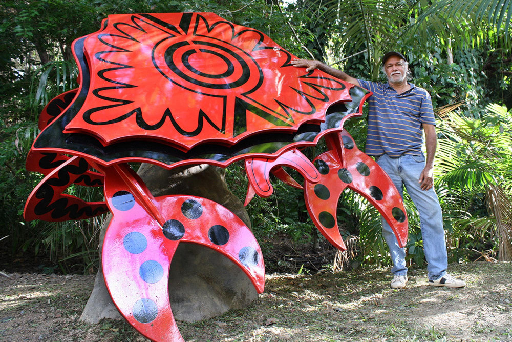 Yidinji artist Hendrick Fourmile with the crab he decorated.