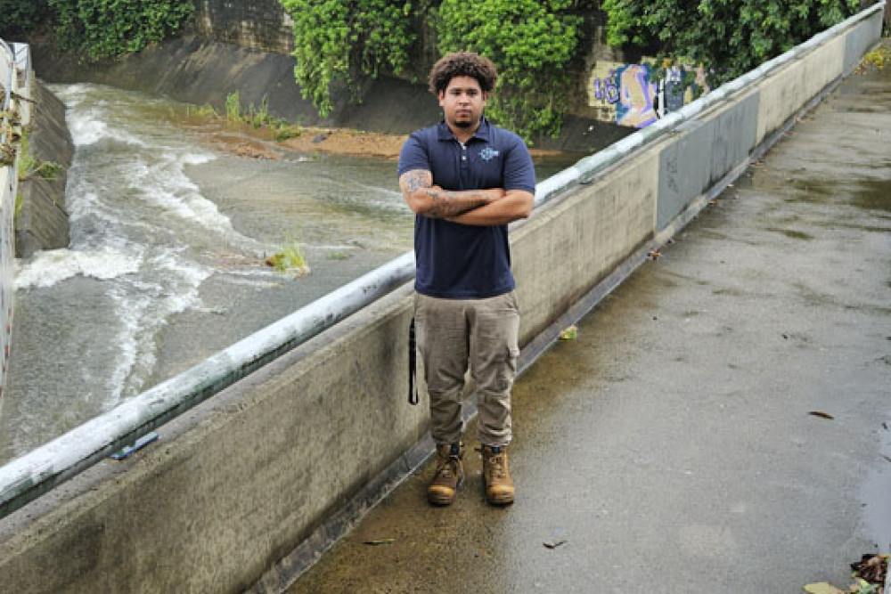 Deon Whitford, 20, who didn’t hesitate to jump into a flooded drain behind Earlville Shopping Town, to help save two young girls from drowning. Picture: Nick Dalton