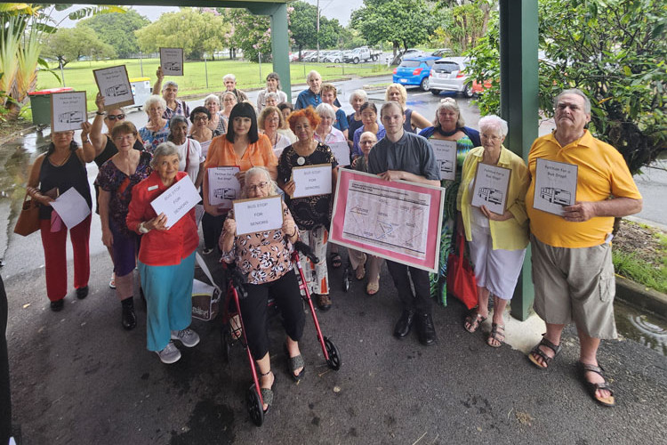 LNP candidate for Cairns Yolonde Entsch (from left, second in front), Cairns and District Senior Citizens Association president Alison Worrell and volunteer Peter Hunt with other members calling for a bus stop outside their Gatton St centre. Picture: Nick Dalton