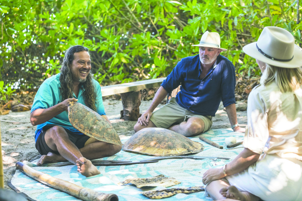 Kuku Yalanji Cultural Habitats guide Linc Walker shows visitors various animal and cultural artefacts as part of a traditional fishing tour. Picture: Tourism Tropical North Queensland