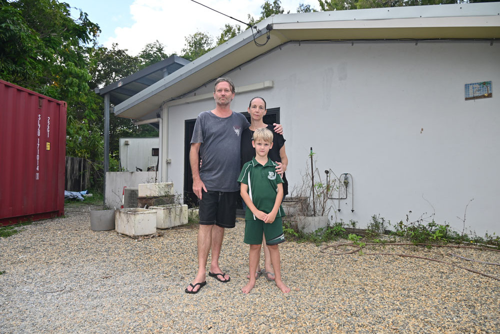 Damon (left), Liz and Jamie Sieverts from Holloways Beach lost their home during the December 2023 floods and are yet to return. Absent: Alexander and Mitchell Sieverts. Picture: Isabella Guzman Gonzalez