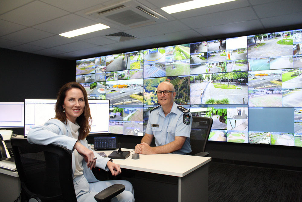 Mayor Amy Eden and Chief Superintendent Kevin Fitzgibbon in the council’s City Safe CCTV control room where a police officer will help monitor trouble during peak times. Picture: Cairns Regional Council