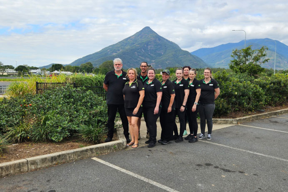 Woolworths Gordonvale store manager Michael Clark (far left) and his team leaders with The Great Pyramid Race president Renee Edwards (second from left). Walsh’s Pyramid is in the background. Picture: Nick Dalton