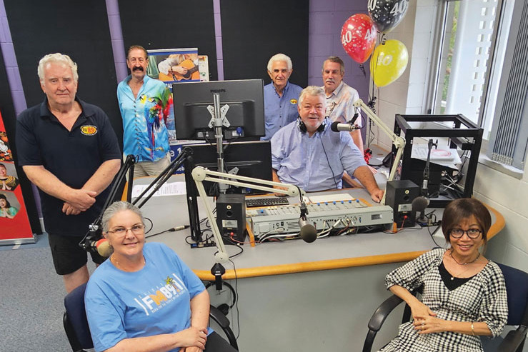 Cairns FM89.1 volunteers and presenters (clockwise from bottom left) Anna Cito, Peter Ricketts, Alan Searle, Mike Friganiotis, Glenn Best, Brian Stevenson and Prapasiri Techo inside one of their Cairns TAFE studios at Manunda. Picture: Nick Dalton