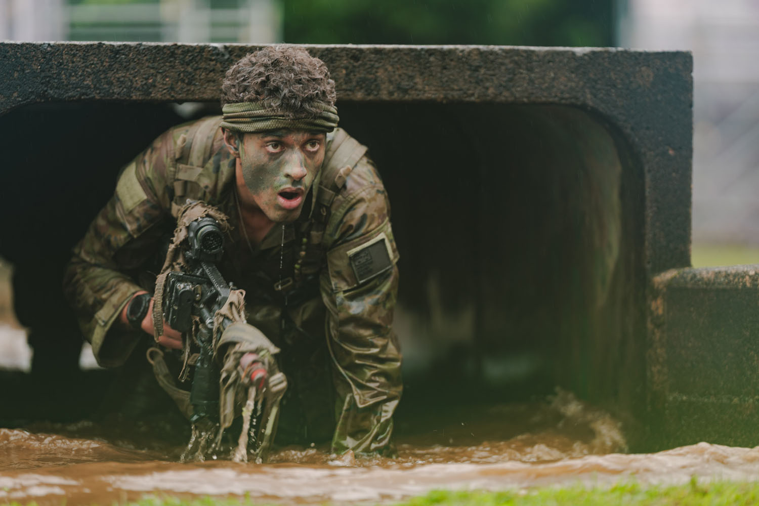 A soldier from The Royal Australian Regiment crawls through the jungles of Tully during the Army's Duke of Gloucester Cup 2025. The soldiers proclaimed Tully as the wettest they had ever seen during exercises that tested their fitness, stamina and skills. Picture: CPL Cameron Pegg