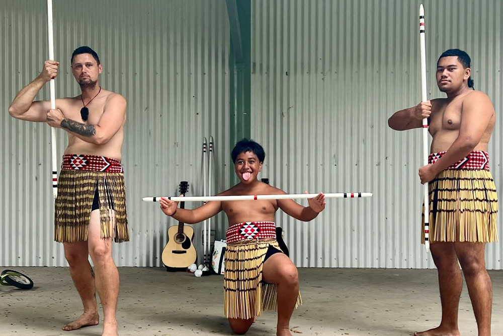 Nga Matawaka Culture Group members Ty Lauder (left) and Nikora Tumai Totorewa (centre) stand proudly in traditional Māori dress. Picture: Nga Matawaka Culture Group