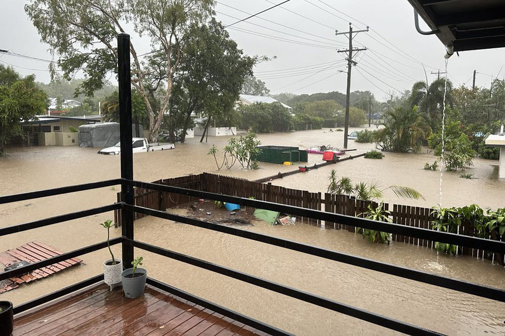 The home of Jason Fagan, Kirby Murtha and Zali at Machans Beach during the floods. Pictures: Supplied