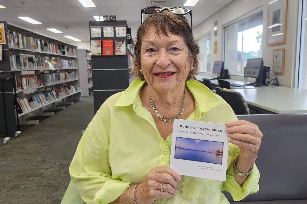 Author Pam Willis Burden with her latest book ‘Beneath Tropic Skies’.