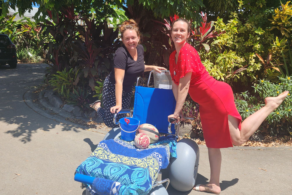 Holly Todd and Erica Mast from Mossman Support Services testing the new beach wheelchair.