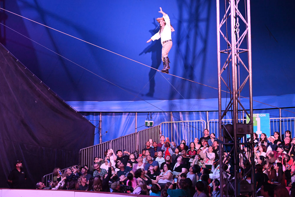 World-record setting highwire artist, Captain Ash Macaw, balances high above the crowd. Picture: Lizzie Vigar