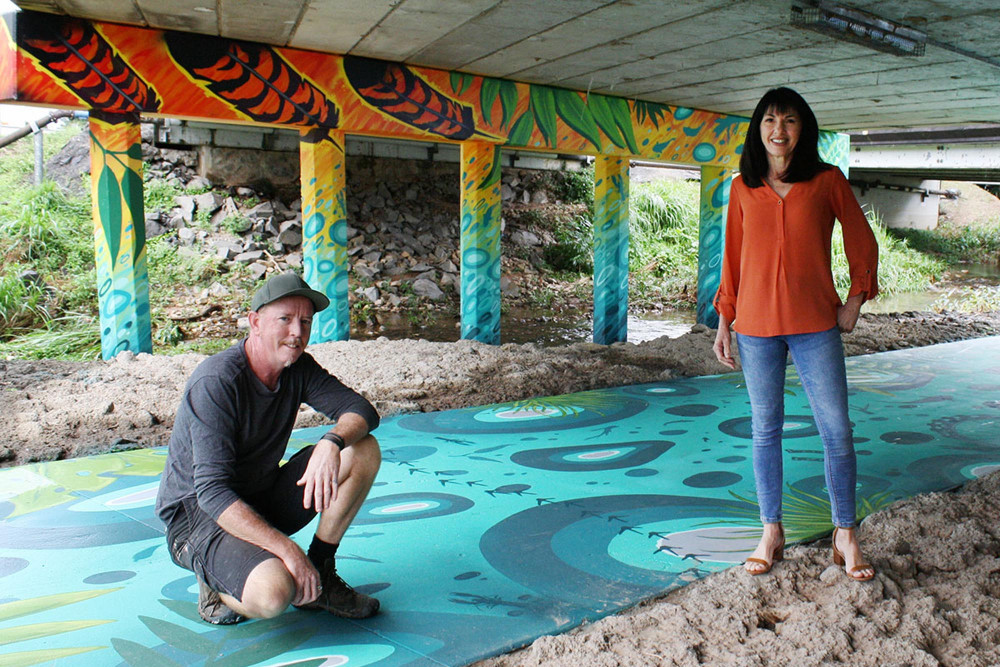 Image: Artist Daniel (Wally) Wallwork and Division 3 Councillor Cathy Zeiger at the Gordon Creek underpass