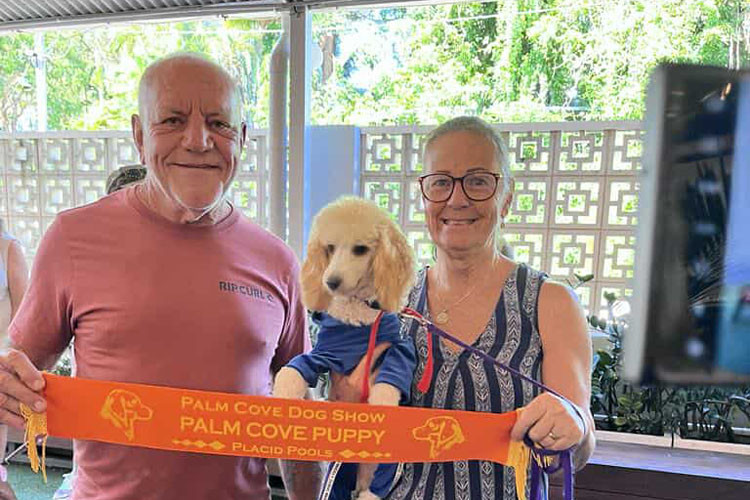 Sponsor Joe Spelta with Palm Cove puppy winner Jasper and owner Sonja Schofield.