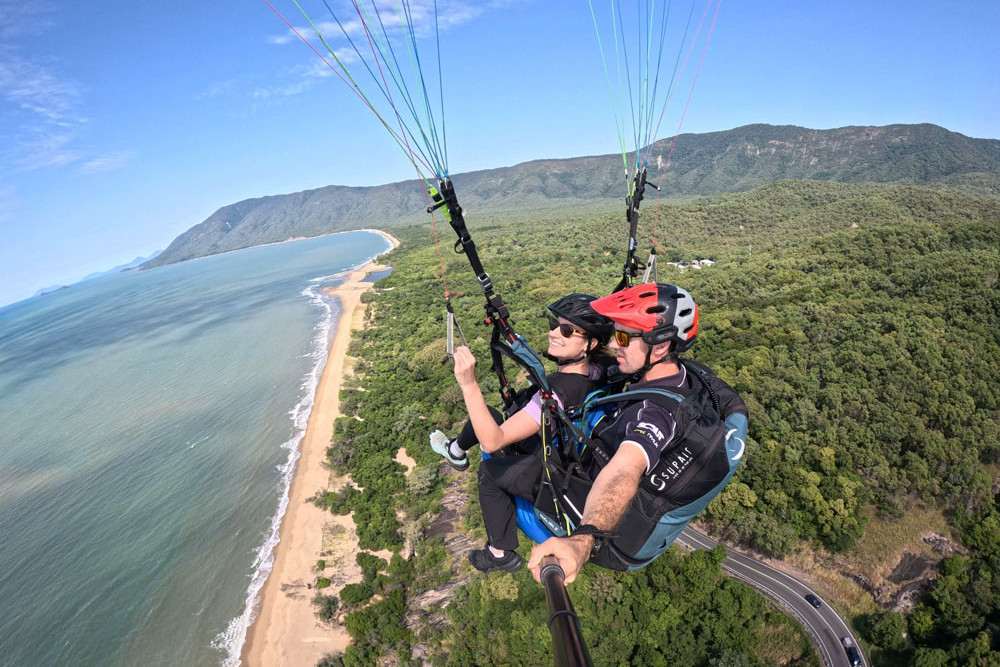 Tandem paragliding above Wangetti Beach on the Captain Cook Highway returns in June. Picture: High Adventure Paragliding