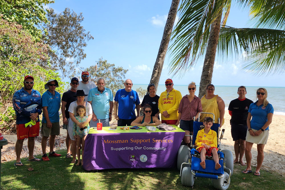 Mossman Support Services and Ellis Beach Surf Life Saving Club at the beach wheelchair handover.