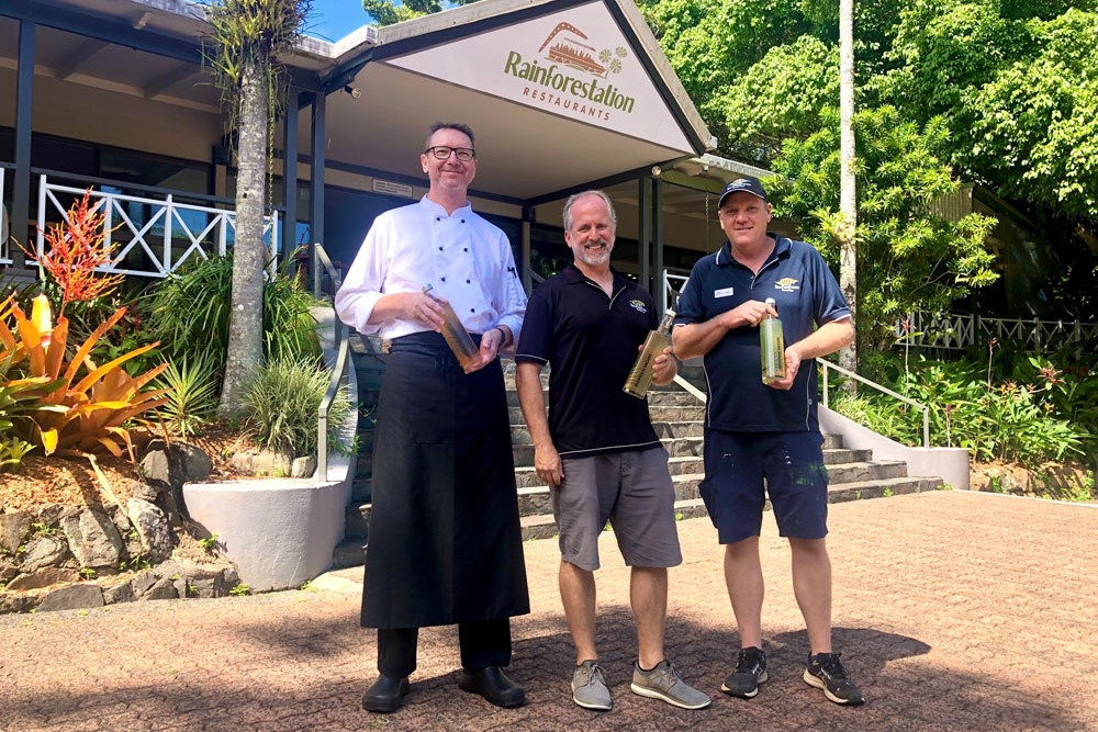 Mountain Groves distiller Christian Auer, CaPTA Group general manager Andrew Hearn and Rainforestation general manager Kieran Sullivan with samples of their tropical liqueurs. Picture: Supplied