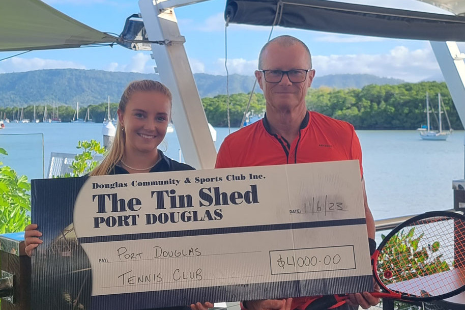 Former Tin Shed staffer Anna Hensall and Port Douglas Tennis Club president Glen Brumby with a $4000 donation.