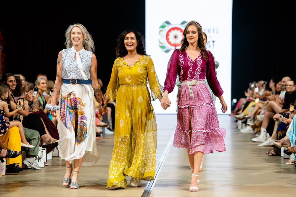 Model Natalie Astwood (left), Secrets of the East founder and designer Scarlett Pragya and model Audrey Anwyl at the Cairns Fashion Week mega showcase. Picture: Chi Yeung – Momento Road Photography