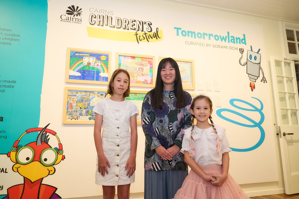 Tomorrowland curator Sorami Ochi (centre) with two young artists participating in the exhibition, offering a glimpse into the future through children’s eyes. Picture: Supplied